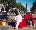 A good view of Las Ramblas : performers, trees, and a long pedestrian-only street stretching sa far as the eyes can see.
